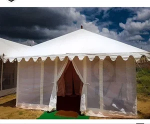 Top 10 Swiss Cottage Tent Manufacturers in India: Looking for the best Swiss cottage tent manufacturer? Then, you are at the right place. We know the Swiss Cottage tents are widely used for luxury camping, eco-tourism, and resort accommodations. These tents provide a luxury experience in the outdoor space. The Swiss Cottage tents are the top choice, which are manufactured using a weather-resistant structure. These tents perfectly blend the comfort of a hotel room with nature’s beauty.

Among numerous manufacturers of Swiss cottage tents, it becomes really difficult to choose the best ones. That’s why we are going to provide you with a list of the Top 10 Swiss Cottage Tent Manufacturers in India, which are selected owing to their unique, customized, and affordable tent swiss cottage tents.

List of the Best Swiss Cottage Tent Manufacturers in India

It is really important to choose the right Swiss cottage tent manufacturer to get the best, affordable, and unique product, which provides you more than you spend. But among several suppliers in the market, selecting a trustworthy, export-quality manufacturer can be challenging. Therefore, we make it easy for you by providing a list of the Top 10 Swiss Cottage Tent Manufacturers in India in the ensuing paragraphs:

Latest Tents

Latest Tents is recognized as one of the top Swiss Cottage tent manufacturing companies in India, which has achieved immense success within 30 years. This company has made more than 100,000+ clients satisfied with its services. It offers customized tent solutions and uses export-quality manufacturing facilities. Latest Tent uses weather-resistant tent structures and spacious as well as modular tent designs.

This organization serves domestic and international markets. Its Swiss Cottage tents are easy as well as quick to install, which are manufactured by an expert manufacturing team. Latest Tents is highly trusted by the event industry and hospitality. It offers low-maintenance tent solutions at competitive as well as affordable prices.

Key Highlights
More than 30 years of experience
Tailored designs for every project
Offers 50+ excellent tent designs
Customer-centric approach
Low-maintenance tent solutions
Suitable for all weather conditions
Ideal for weddings, resorts & events
Competitive and affordable pricing
Indian Tent Manufacturer by Talukas

Indian Tent Manufacturer by Talukas was established in 1962, and with decades of experience, it has achieved immense success. This organization is a trusted global exporter and supplier. It is an ISO-certified tent manufacturer, which is known as one of the top 10 Swiss Cottage tent manufacturers in India. This company has handcrafted luxury tent specialists and offers customized tent solutions. It has presence in other countries as well, such as the USA, the UK, Australia & Canada.

Key Highlights
Wide range of quality eco-friendly tents
Easy Installation & maintenance
Premium-quality raw materials
Customized tent solutions
More than 60 years of experience
Worldwide presence
Durable & weather-resistant tents
Reusable & recyclable tent solutions
Pashupati Enterprises

Pashupati Enterprises is one of the Swiss cottage tent manufacturing companies in India, which is highly trusted by resorts as well as glamping projects. With more than 10 years of expertise, this company has achieved immense success in the hospitality industry. This organization is FR-certified Canvas and offers strong frame construction options. It provides all-weather tent solutions with aluminium as well as steel frame options.

As a leading Swiss cottage tent company in India, Pashupati Enterprises provides completely customized interior layouts. This company provides Verandah, Bedroom, and Bathroom design. It offers multiple fabric & frame options.

The Villa Tent

The Villa Tent serves both national as well as international markets. This company is considered one of the top 10 Swiss Cottage tent manufacturers in India, which designs tents that match 5-star hotel room standards. It offers ready-to-fix canopies for easy installation. This organization provides a wide range of eco luxury, resort, beach, semi-permanent, gazebo, and Indian tents. It provides premium quality at competitive pricing and supplies to luxury hotels, guesthouses, and resorts.

Mahavira Tents (India) Pvt. Ltd.

Another top Swiss cottage tent manufacturing company in India is Mahavira Tents (India) Pvt. Ltd., which offers premium-quality solutions. This organization has an experienced and skilled team, which follows strict quality control to provide quality Swiss cottage tents. It has an advanced manufacturing facility and provides competitive pricing. Mahavira Tents (India) Pvt. Ltd. has more than 20 years of experience and offers customized product solutions.

Glamping Tents

Glamping Tents is another one of the best Swiss cottage tent manufacturers in India that has more than 16 years of experience. This organization has installed 3,640+ tents successfully. It has more than 50 skilled as well as experienced team members for manufacturing premium-quality tents. Glamping Tents has completed 380+ projects with an eco-friendly manufacturing approach. This organization offers a diverse range of luxury tents, which are manufactured from weather-resistant tent structures. It offers innovative as well as durable tent designs that are manufactured using premium-quality materials.

TentStore.in

TentStore.in has more than 18 years of experience in providing a wide range of premium tent solutions. This company has successfully delivered 1000+ tents and made more than 5,000 clients happy. It exports its tents to more than 25 countries with customised options. As a leading Swiss Cottage tent company, TentStore.in offers waterproof tent solutions at afforable prices and complete installation support. This organization provides customer-focused services and OEM manufacturing available. It offers made-to-order tent sizes.

Madras Canvas Co.

Madras Canvas Co. is an ISO 9001:2015-certified company, which is considered the best manufacturer, supplier, and exporter. This organization uses premium virgin polyethylene materials. Its products are 100% waterproof and weatherproof. As a leading luxury Swiss cottage tent manufacturer in India, Madras Canvas Co. provides lightweight and easy-to-handle designs. This company offers cost-effective and repairable products. It continues to improve the quality of its products.

Handmade Crafts

Handmade Crafts is one of the top 10 Swiss cottage tent manufacturers in India, which has specialists for offering creative and designer tents that are created keeping classic as well as contemporary tent designs in mind. This organization offers high-quality craftsmanship and onsite installation services at reasonable prices. It is GST registered business that provides custom projects for resorts. Handmade Crafts was founded in the year 2001 and still it is offering aesthetic and durable tent structures, which are widely used.

Bhagwati Suppliers

Bhagwati Suppliers is known as one of the best Swiss cottage tent companies in India that was established in the year 1981. This company is not only manufactures but also exports the quality tents with customized option. It offers weather and water-resistant tents. Bhagwati Suppliers follows international quality standards and has achieved immense success within 4 decades. It has made worldwide market presence by offering durable as well as lightweight tent solutions, which are easy to install.

FAQ-Swiss Cottage Tent Manufacturers in India

Can Swiss Cottage tents be manufactured according to resort room specifications?

Yes, manufacturers can design Swiss Cottage tents based on the required room sizes, configurations, sleeping quarters, bathroom space, windows, doors, and interior designs.

Can manufacturers provide ready-to-install Swiss Cottage tent solutions?

Many manufacturers can supply complete solutions with the main structure, covering, flooring, doors, windows, and other components, along with installation support.

What is the benefit of purchasing Swiss Cottage tents directly from a manufacturer?

You can purchase the Swiss Cottage tent directly from the manufacturer. You can also share your customisation, bulk requirements, delivery and installation.

Can Swiss Cottage tents be relocated from one site to another?

Depending on the design and construction of Swiss Cottage structures many Swiss Cottage structures can be. Relocated. The manufacturer can advise whether a particular Swiss Cottage model is suitable, for repeated relocation.

What should I provide to a manufacturer before placing a Swiss Cottage tent order?
Talukas tent
